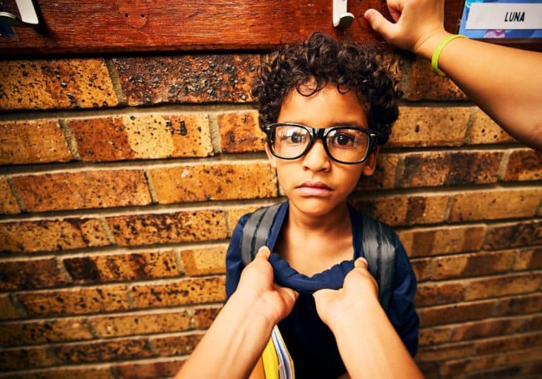Young boy being bullied at school
