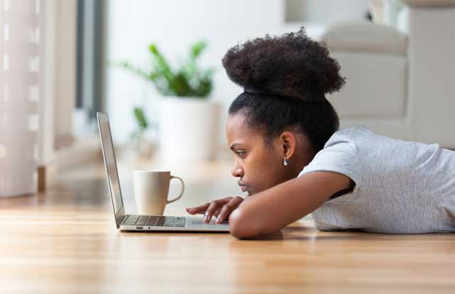 Student sitting with their laptop thinking about the psychology of failure