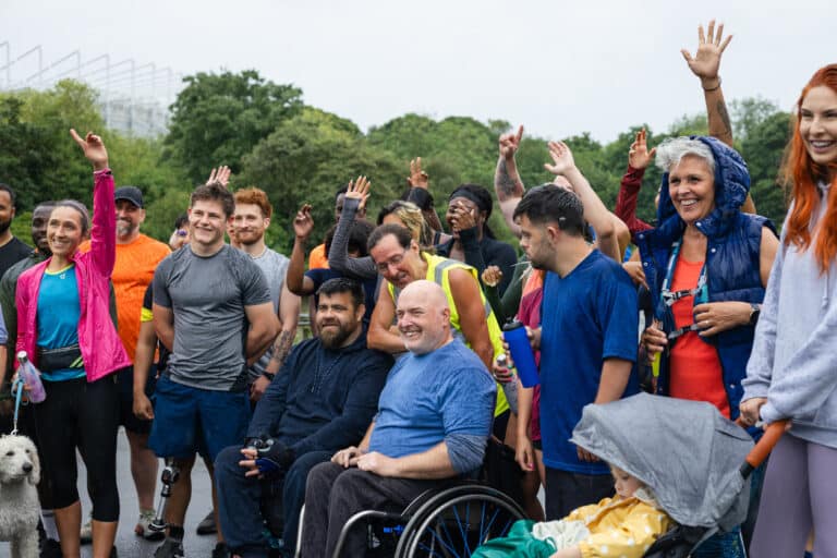 Inclusive group of people starting a run.
