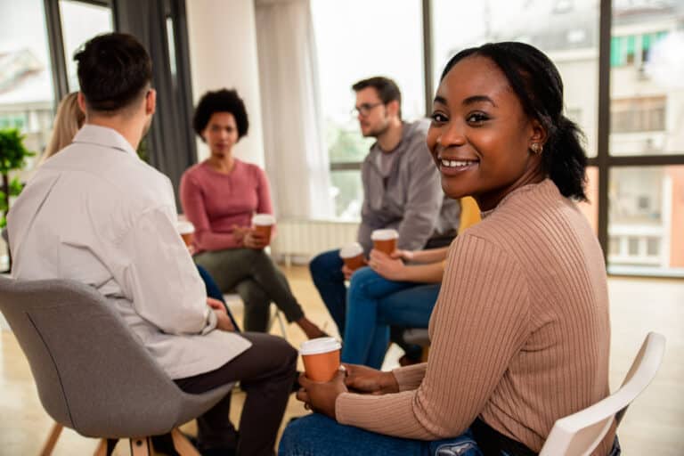 Diverse group people in a community discussing their wellbeing